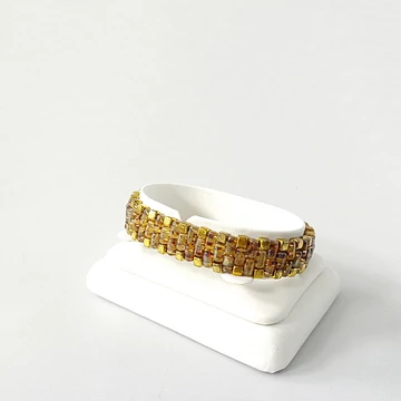 Rullás borostyán színű karkötő